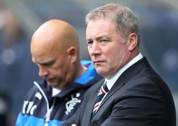A grim-faced Ally McCoist looks on during Rangers 2-1 defeat by Hearts at Ibrox yesterday. Picture:Getty
