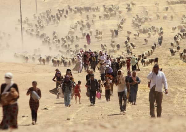 Displaced people from the minority Yazidi sect, fleeing violence from forces loyal to the Islamic State in Sinjar town. Picture: Reuters