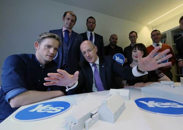 Finance secretary John Swinney with young, Yes-supporting Scottish entrepreneurs yesterday. Picture: Allan Milligan