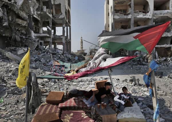 Palestinians under a shelter in the town of Beit Lahiya. Picture: AP