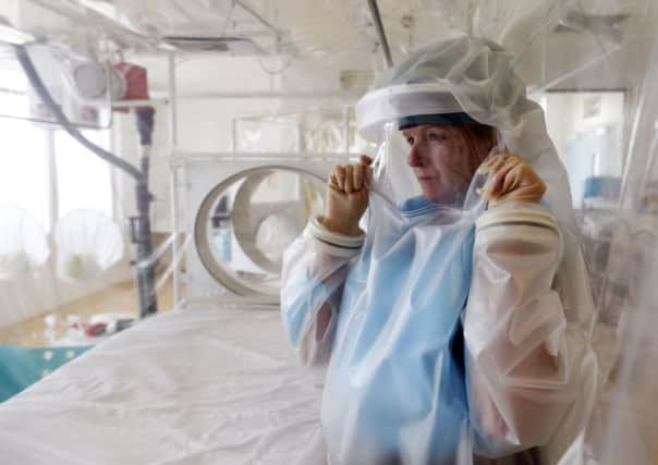Senior matron Breda Athan in the high-level isolation apparatus available at the Royal Free Hospital in London. Picture: PA