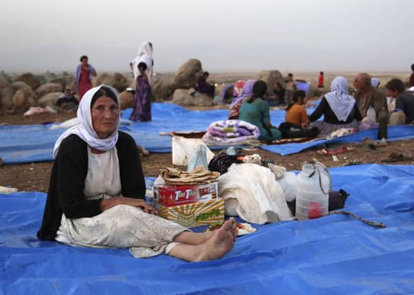 Displaced Iraqis from the Yazidi community settle at a camp at Derike, Syria. Picture: AP