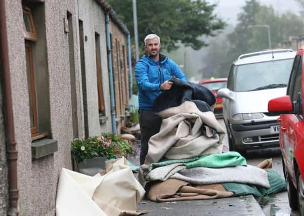 John Fielding had to throw out his carpets after flooding hit his home in Dallas, Morayshire. Picture: Peter Jolly
