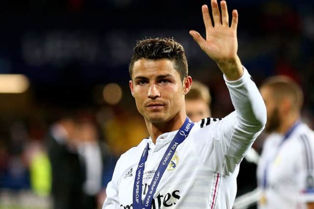 Cristiano Ronaldo waves to fans following his team's  2-0 victory against Sevilla. Picture: Getty