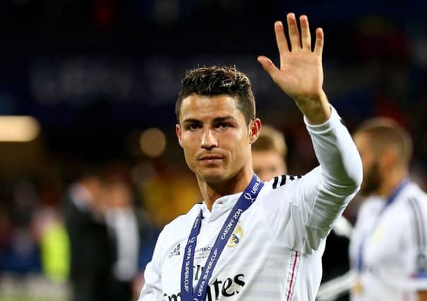 Cristiano Ronaldo waves to fans following his team's  2-0 victory against Sevilla. Picture: Getty