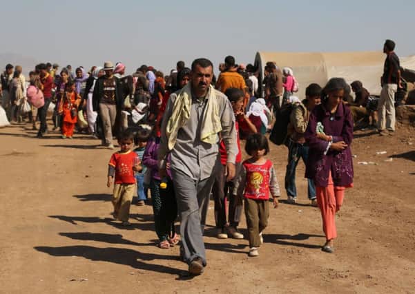 Displaced Iraqis from the Yazidi community arrive at Nowruz camp, in Derike, Syria. Picture: AP