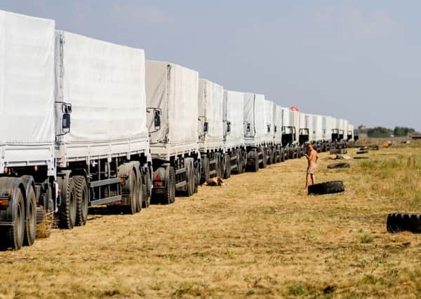 The Russian humanitarian aid trucks stand idle at a military base in Voronezh while discussions about their route into Ukraine continue. Picture: Getty