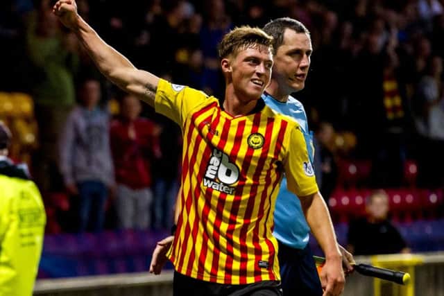 Gary Fraser celebrates his strike as Partick go three goals up. Picture: SNS