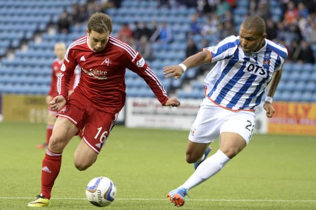 Kilmarnock's Josh Magennis goes up against Peter Pawlett (left). Picture: SNS
