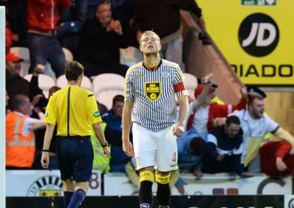 Dejection for St Mirren Captain Marc McAusland as his side concede their second goal. Picture: SNS