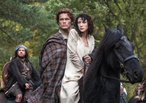 Sam Heughan as Jamie Fraser and Caitriona Balfe as Claire Randall in a scene from Outlander. Picture: AP