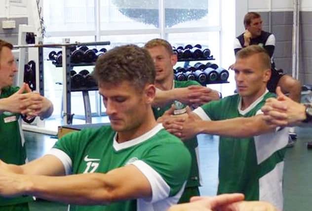 Albert Taar pictured far right, trains with Hibs at their East Mains training centre. Picture: Hibernian FC/Facebook