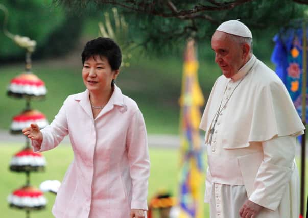 Park Geunhye with Pope Francis after a welcoming ceremony at the presidential Blue House in Seoul yesterday. Picture: Getty