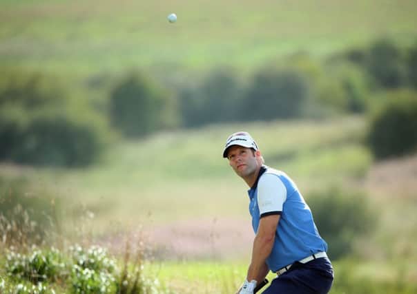 Bradley Dredge chips at the 10th hole at the start of a superb homeward run in Aalborg.  Picture: Getty