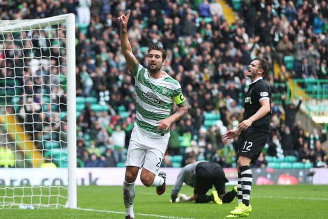Celtic's Charlie Mulgrew celebrates after he scores against Dundee United at Celtic Park. Picture: Getty