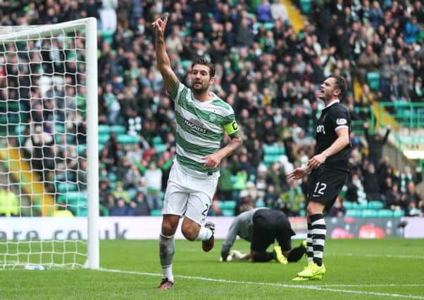 Celtic's Charlie Mulgrew celebrates after he scores against Dundee United at Celtic Park. Picture: Getty