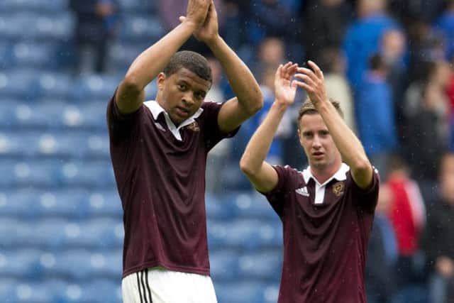 Danger man Osman Sow celebrates after scoring the winner for Hearts against Rangers. Photograph: Rob Caey/SNS