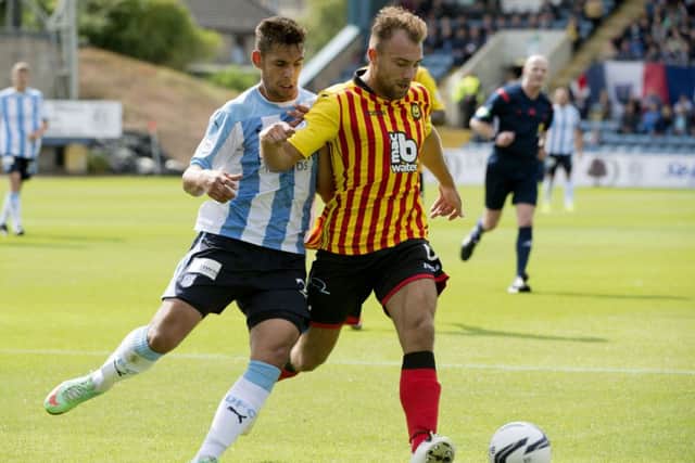 Partick Thistle's Conrad Balatoni holds off Dundee's Luka Tankulic. Picture: Kenny Smith