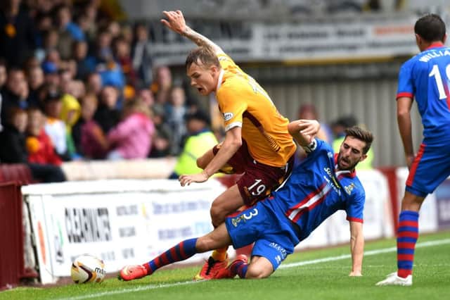 Motherwell's Lee Erwin is challenged by Inverness CT captain Graeme Shinnie. Picture: Alan Harvey