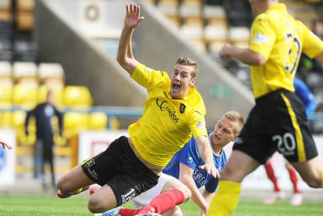 Livingston striker Jordan White attracts the attentions of Thomas OBrien yesterday. Photograph: Neil Hanna Photography