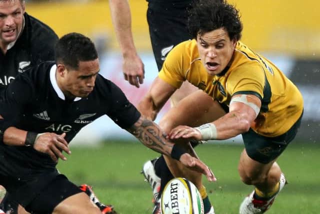 New Zealands Aaron Smith, left, and Australias Matt Toomua dive for a loose ball during their test match. Photograph: AP/Rick Rycroft