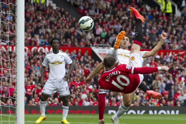 Wayne Rooney, bottom right, equalises against Swansea City at Old Trafford yesterday. Photograph: Jon Super/AP Photo