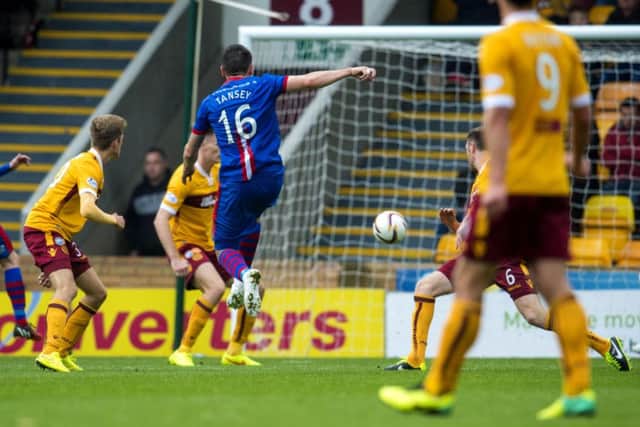 Greg Tansey strikes the ball past Dan Twardzik late in the first half to put Inverness ahead. Picture: SNS