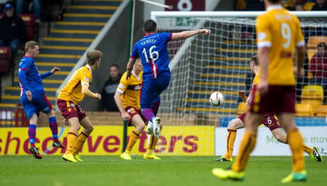 Greg Tansey strikes the ball past Dan Twardzik late in the first half to put Inverness ahead. Picture: SNS
