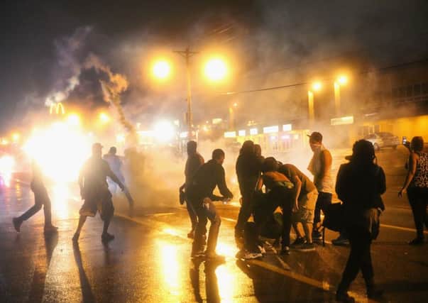 Police fire tear gas at demonstrators protesting at the shooting of Michael Brown. Picture: Getty
