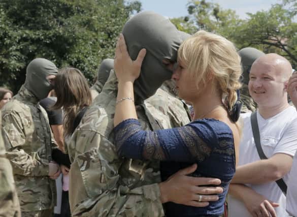 Volunteers being sent to eastern Ukraine to fight proRussian separatists say goodbye. Picture: AP