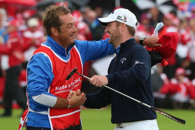 Marc Warren celebrates with his caddie Ken Herring after winning the Made In Denmark event. Picture: Getty