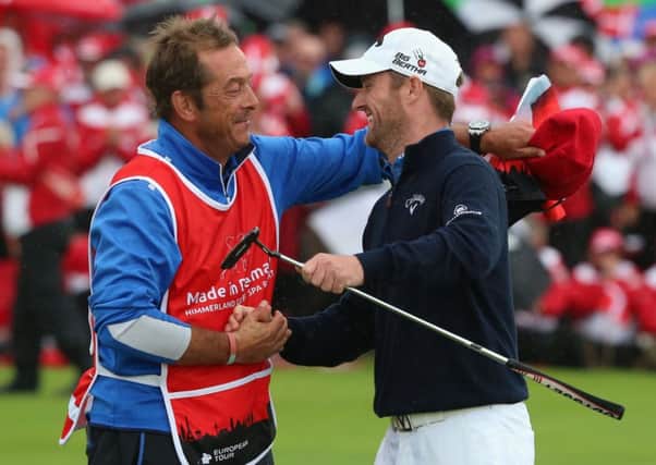 Marc Warren celebrates with his caddie Ken Herring after winning the Made In Denmark event. Picture: Getty