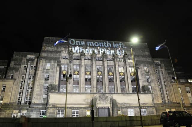 St Andrew's House headquarters was lit up last night with a call for Alex Salmond to name his plan B on the currency. Picture: Greg Macvean