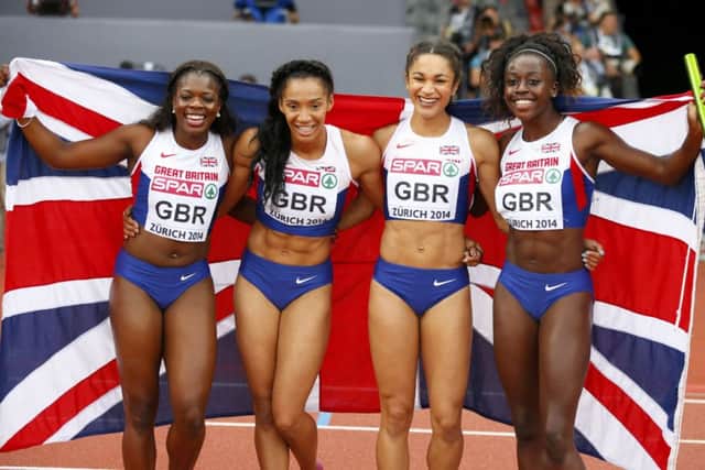 Asha Philip, Ashleigh Nelson, Jodie Williams and Desiree Henry celebrate their gold medal. Picture: Reuters