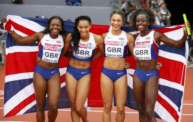 Asha Philip, Ashleigh Nelson, Jodie Williams and Desiree Henry celebrate their gold medal. Picture: Reuters
