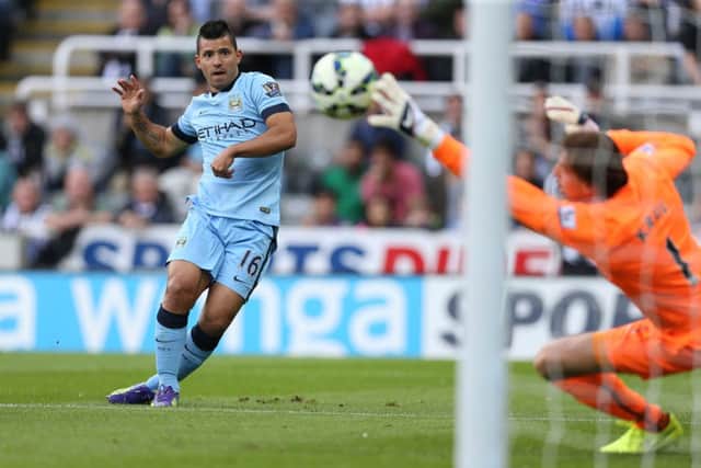 Manchester City substitute Sergio Aguero fires his shot past Newcastle United goalkeeper Tim Krul. Picture: AFP/Getty