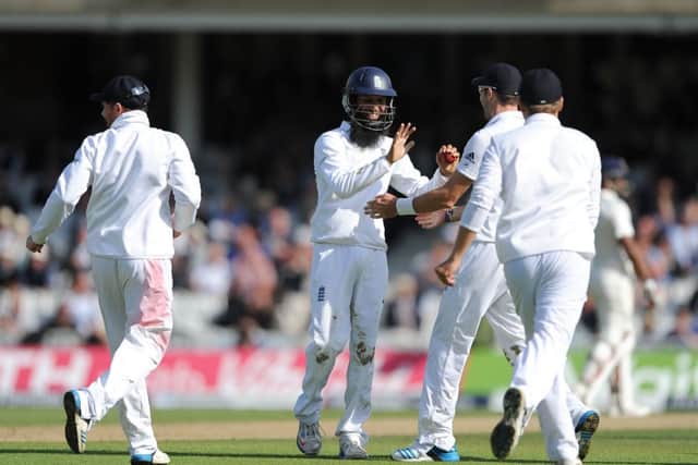 Moeen Ali takes the plaudits of his teammates after catching Ishant Sharma to seal the Oval win. Picture: PA