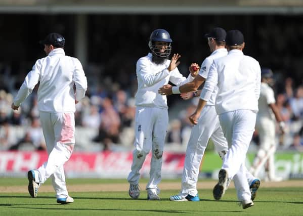Moeen Ali takes the plaudits of his teammates after catching Ishant Sharma to seal the Oval win. Picture: PA