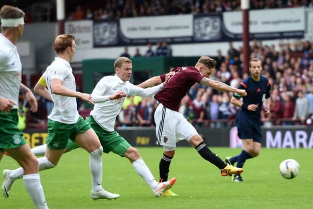 Sam Nicholson, right, rifles Hearts into a 76th-minute lead with a sweetly-struck 20-yard shot. Picture: SNS