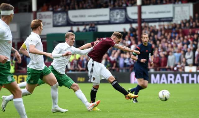 Sam Nicholson, right, rifles Hearts into a 76th-minute lead with a sweetly-struck 20-yard shot. Picture: SNS