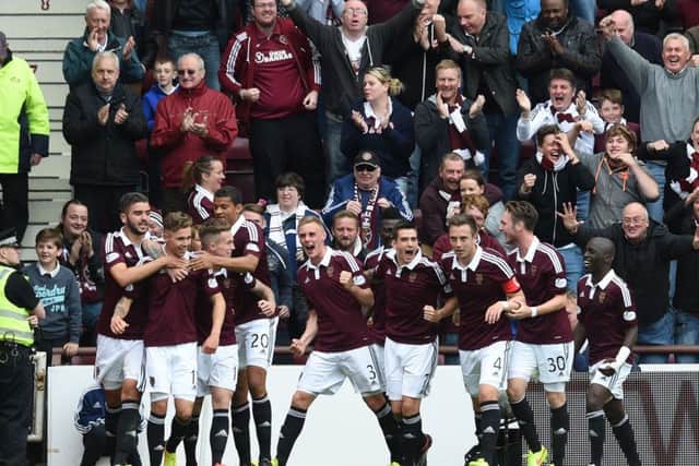 Hearts celebrate their opening goal in the Edinburgh derby. Picture: SNS