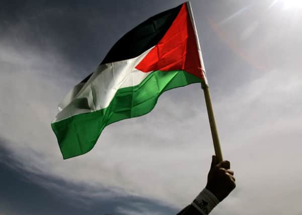A Palestinian flag flown over Glasgow City Chambers has led to the cancellation of a visit from a Fortune 500 firm based in the US. Picture: AP