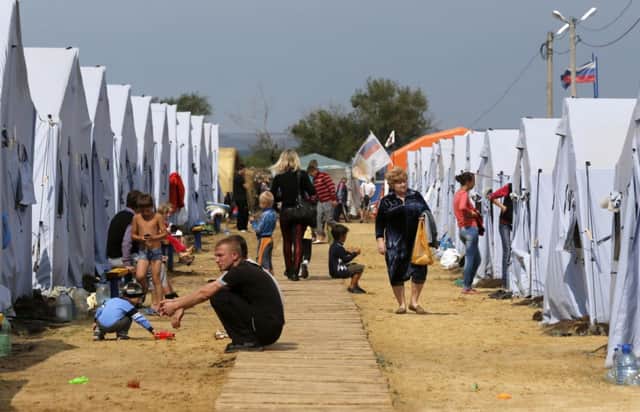 People gather at a temporary tent camp set up for Ukrainian refugees outside Donetsk, near the RussiaUkraine border. Picture:Reuters