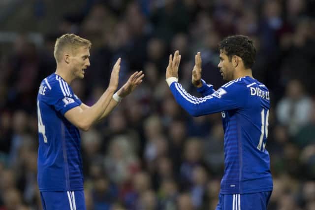 New Chelsea signing Diego Costa, right, celebrates with fellow scorer Andre Schurrle after his first goal. Picture: Jon Super/AP