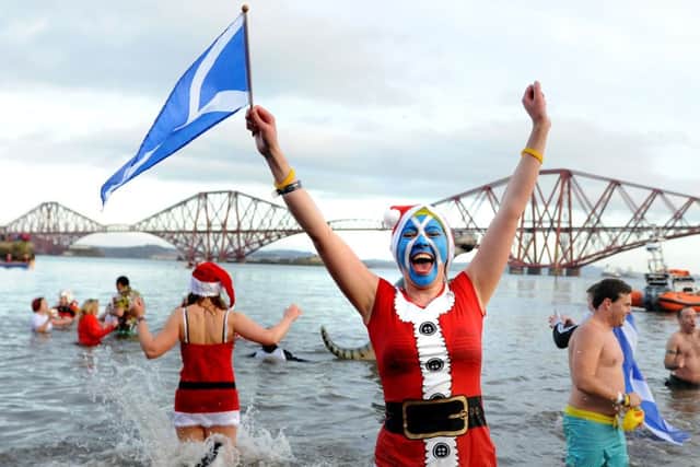 A Loony Dooker braves the cold at South Queensferry on New Year's Day. Picture: Neil Hanna