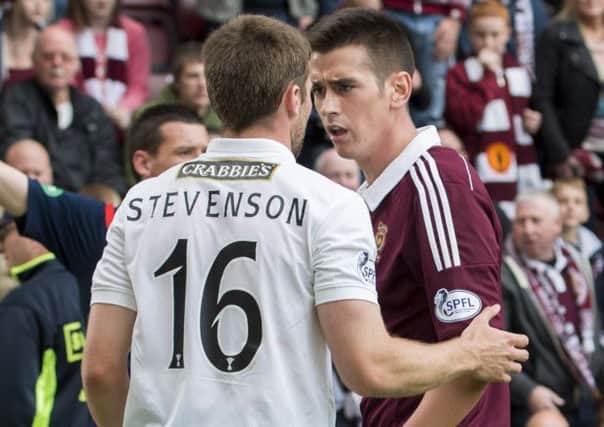 Jamie Walker (right) and Lewis Stevenson clashed in stoppage time of Sunday's Edinburgh derby. Picture: SNS