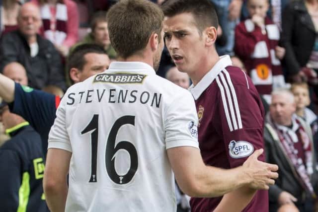 Jamie Walker (right) and Lewis Stevenson clashed in stoppage time of Sunday's Edinburgh derby. Picture: SNS