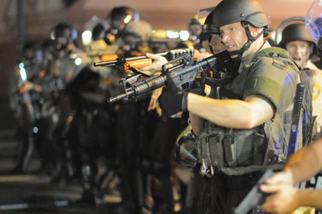 Law enforcement officers watch on during a protest in Ferguson. Picture: AFP