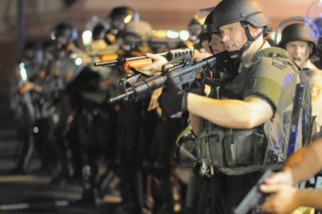 Law enforcement officers watch on during a protest in Ferguson. Picture: AFP
