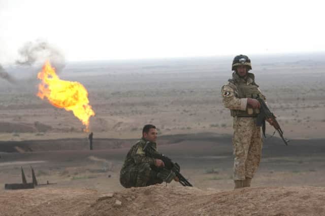 An Iraqi commando in the al-Fauqa Field, one of a cluster of oilfields in Maysan province. Picture: Getty Images